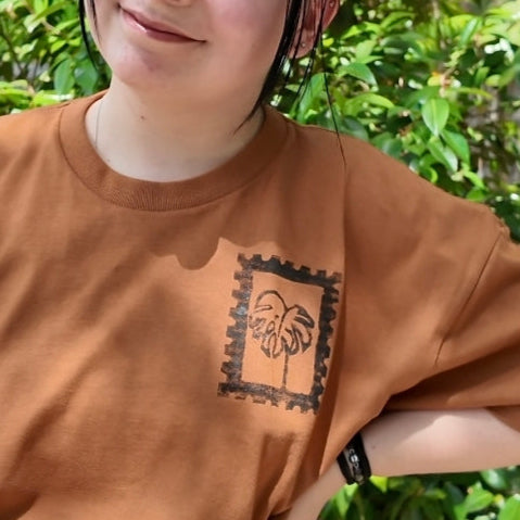 MADE TO ORDER 2-3WK TURNAROUND | Burnt Orange 'Keep Growing' Monstera Block Printed Baggy T-Shirt | Oversized | Hand-Inked | XS-3XL | Soft and Sensory Friendly | UNISEX |