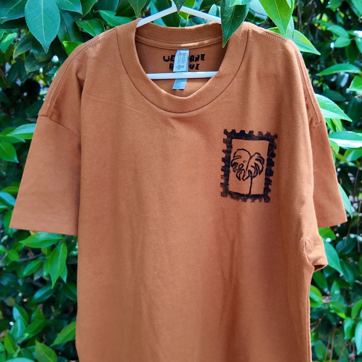 MADE TO ORDER 2-3WK TURNAROUND | Burnt Orange 'Keep Growing' Monstera Block Printed Baggy T-Shirt | Oversized | Hand-Inked | XS-3XL | Soft and Sensory Friendly | UNISEX |